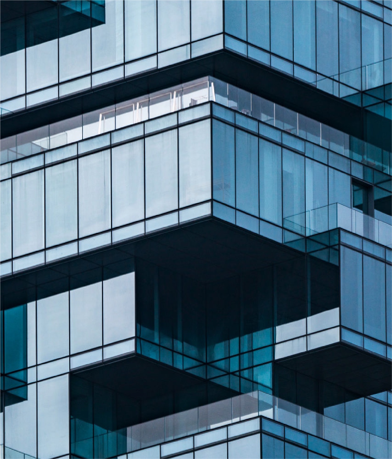 Skyscraper with an abstract design that resembles an uneven stack of glass cubes.